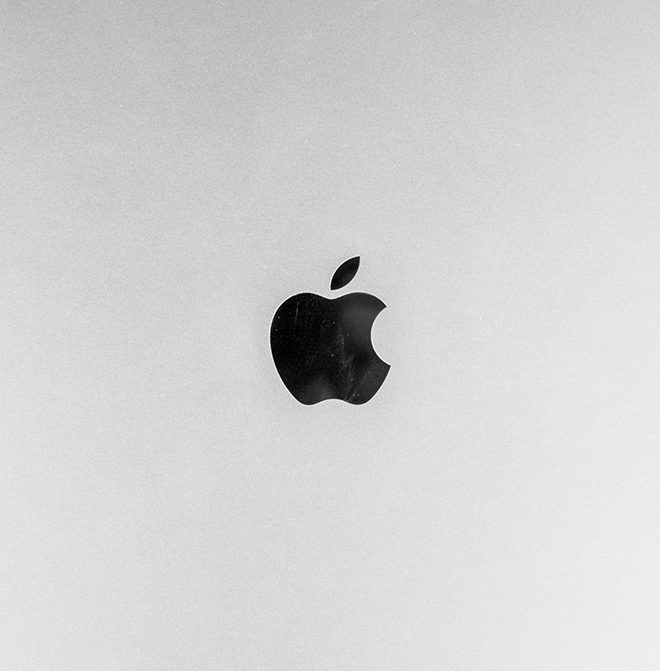 give alt text, caption, discription for apple logo on white 'Apple: The Minimalist Elegance of White' image
