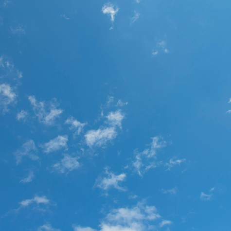 A captivating image of an expansive open blue sky, showcasing the therapeutic essence of blue color psychology in evoking feelings of serenity, freedom, and vastness.